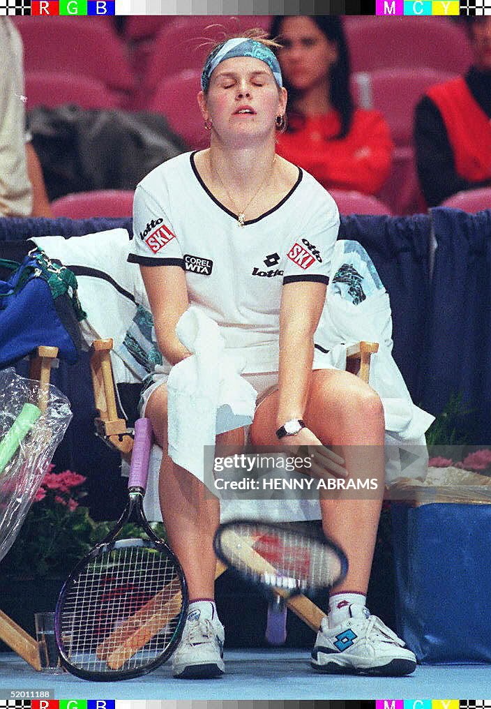 Sixth-seeded Anke Huber throws her racket to the g