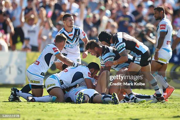Andrew Fifita and Michael Ennis of the Sharks celebrate a try scored by Matt Prior of the Sharks during the round six NRL match between the Cronulla...
