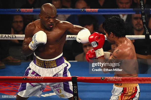 Timothy Bradley Jr. Throws a left at Manny Pacquiao during their welterweight fight on April 9, 2016 at MGM Grand Garden Arena in Las Vegas, Nevada.