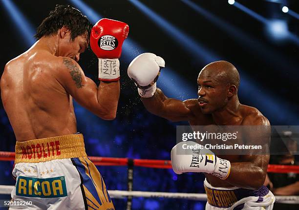 Timothy Bradley Jr. Throws a right at Manny Pacquiao during their welterweight championship fight on April 9, 2016 at MGM Grand Garden Arena in Las...