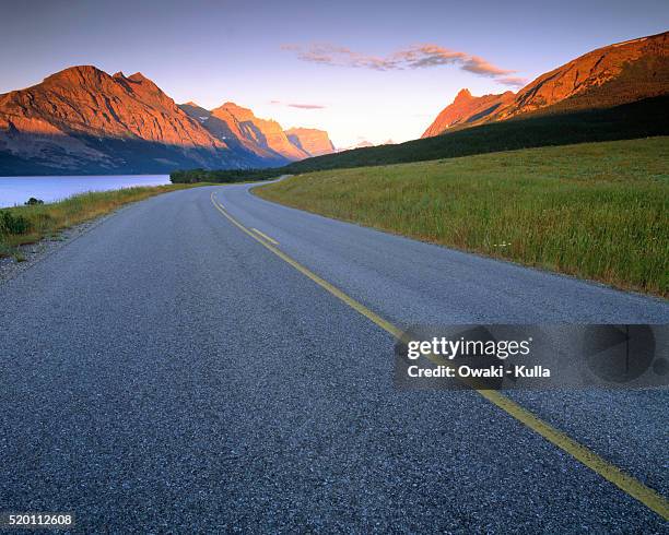 road winding through glacier national park - swimming lane marker bildbanksfoton och bilder