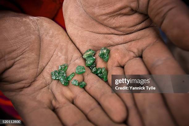 mining for tsavorite, green garnet in tanzania - garnet stock pictures, royalty-free photos & images