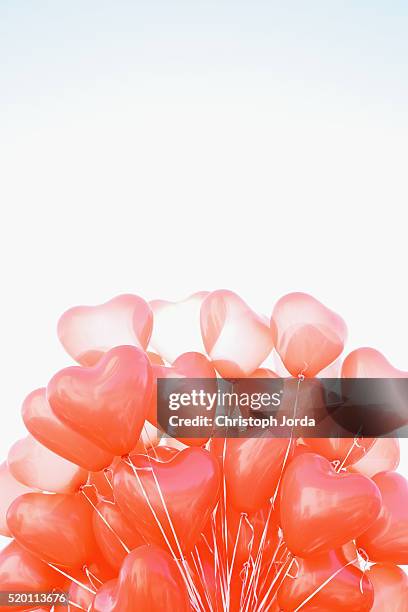 heart-shaped balloons - heart balloon stock pictures, royalty-free photos & images