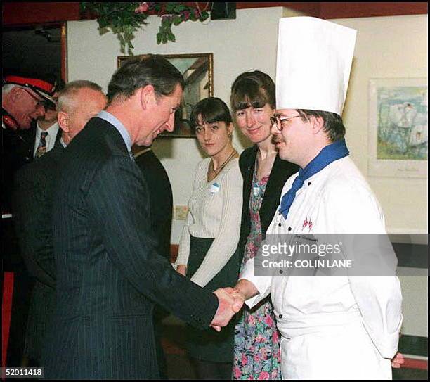 The Prince of Wales speaks with Hillsborough disaster victim chef Gary Unsworth when the Prince attended the Winged Fellowship's "Sandpiper's"...