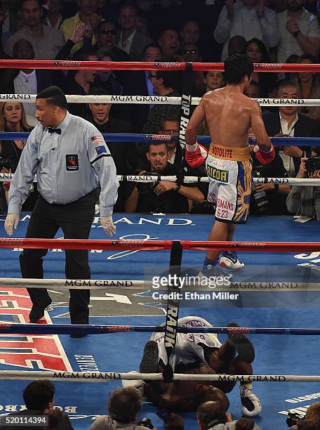Manny Pacquiao walks to his corner after knocking down Timothy Bradley Jr. During their welterweight championship fight on April 9, 2016 at MGM Grand...
