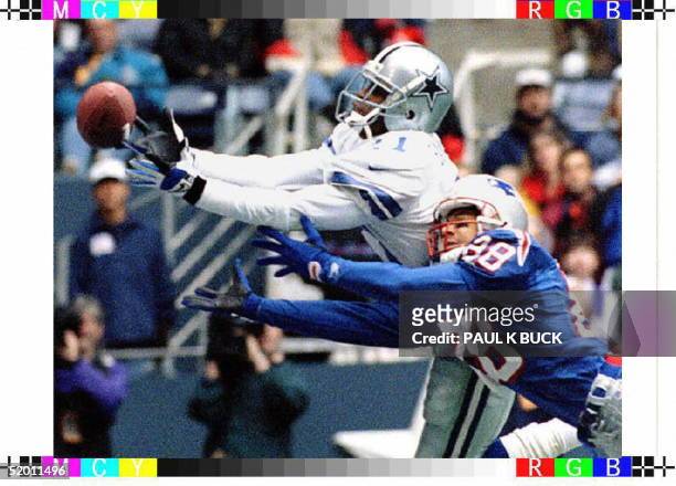 Dallas Cowboys defensive back Deion Sanders breaks up a pass intended for New England Patriots receiver Terry Glenn during first half action in their...