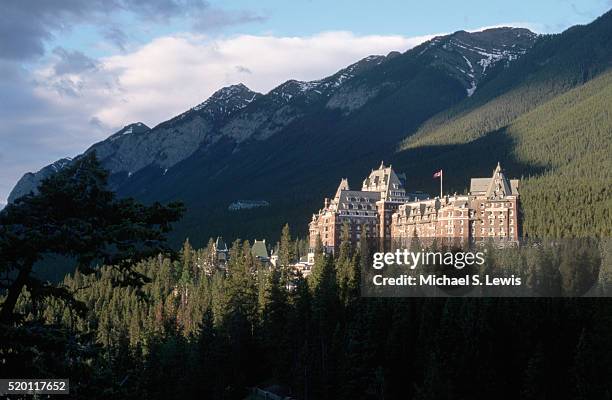 shadows surrounding banff springs hotel - banff springs hotel stock pictures, royalty-free photos & images