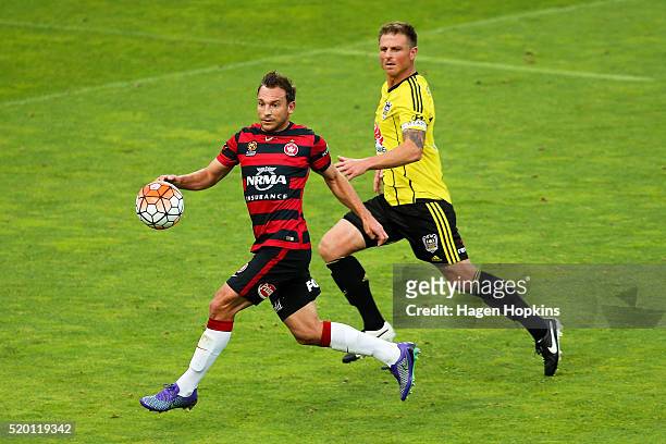 Brendon Santalab of the Wanderers controls the ball under pressure from Ben Sigmund of the Phoenix during the round 27 A-League match between the...