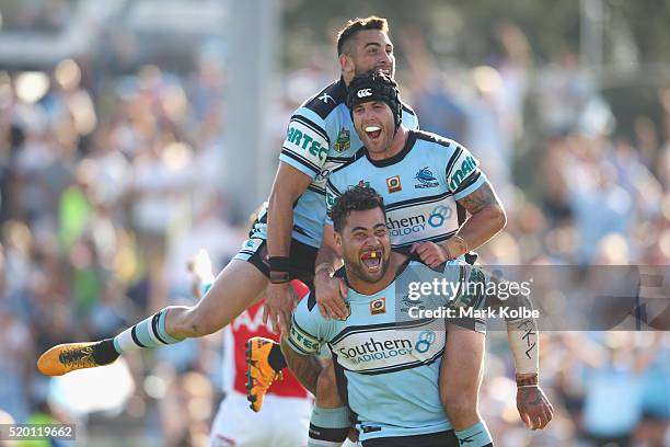 Jack Bird, Michael Ennis and Andrew Fifita of the Sharks celebrate Andrew Fifita scoring a try during the round six NRL match between the Cronulla...