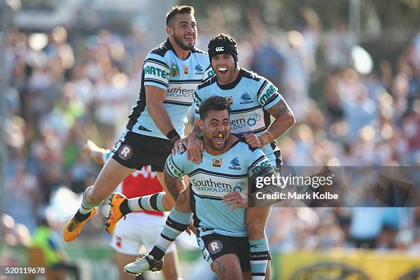 Jack Bird, Michael Ennis and Andrew Fifita of the Sharks celebrate Andrew Fifita scoring a try during the round six NRL match between the Cronulla...