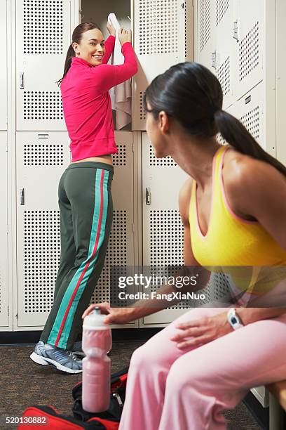 two women in a locker room - pictures of containers seized by customs stock pictures, royalty-free photos & images