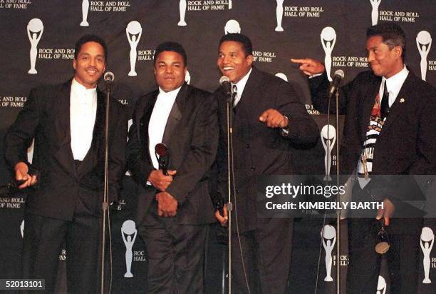 Four members of the Jackson Five brothers Marlon, Tito, Jackie and Jermaine Jackson pose for the media after they were inducted into the12th Annual...