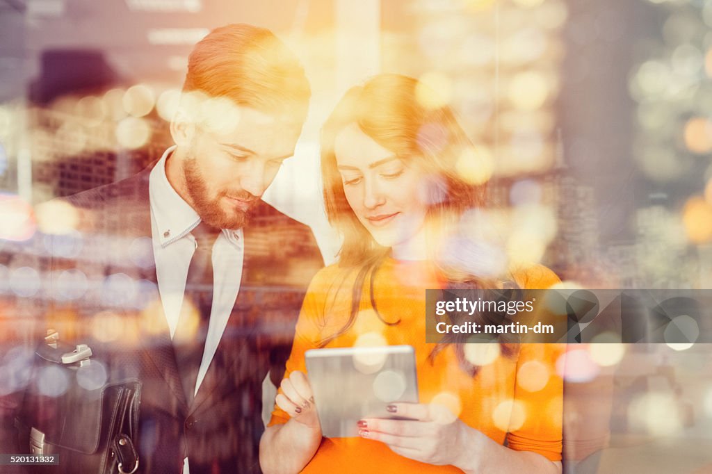 Business people using tablet in the office