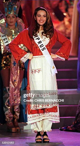 Miss Cyprus Korina Nikolaou models her costume dress while rehearsing for the Miss Universe Pageant 13 May at the Miami Beach Convention Center,...