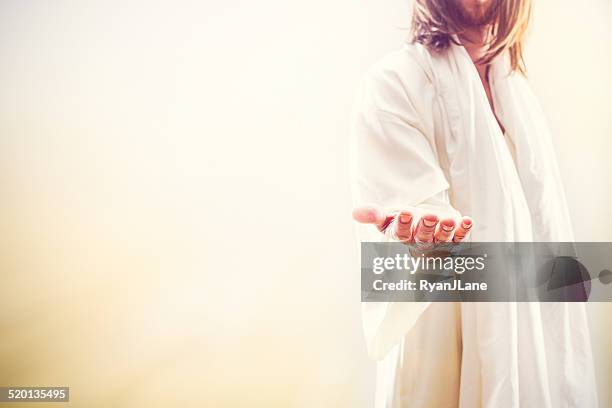 jesus christ extending welcoming hand - jezus christus stockfoto's en -beelden