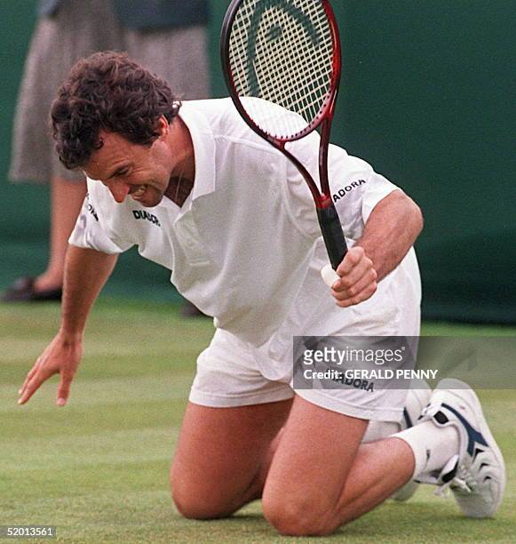 Argentinian Javier Frana smashes his raquet on the ground during his match against Czech Martin Damm on the first day of the Wimbledon Tennis...