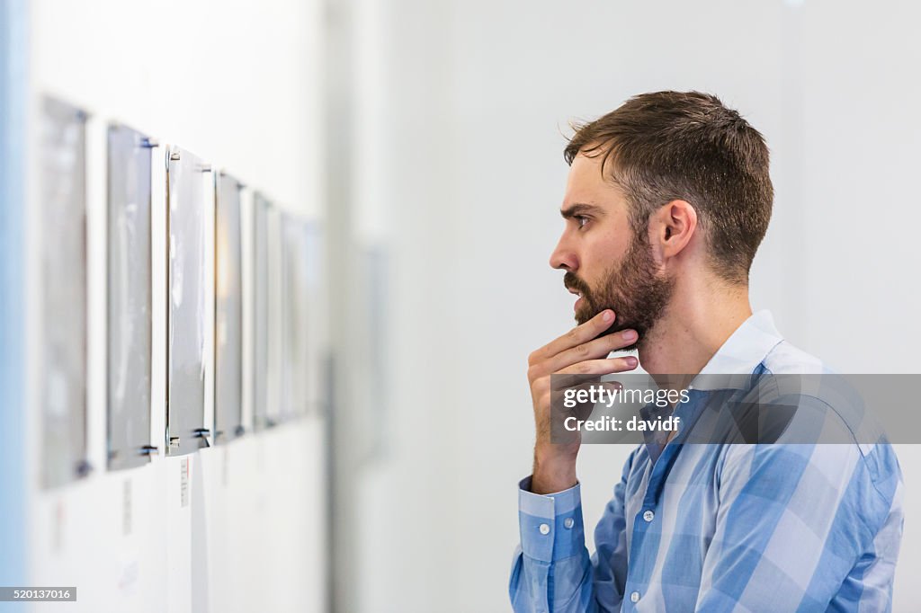 Hipster Man Visiting an Art Gallery