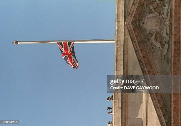 The Union Jack flies at half mast over Buckingham Palace 06 September as the funeral procession of Diana, Princess of Wales, approached the palace on...