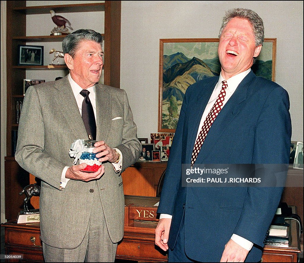 US President-elect Bill Clinton (r) breaks into a