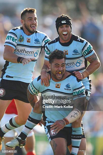 Jack Bird, Michael Ennis and Andrew Fifita of the Sharks celebrate Andrew Fifita scoring a try during the round six NRL match between the Cronulla...