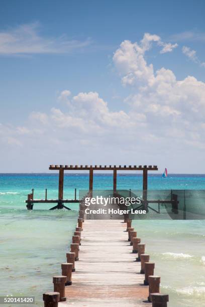 pier from beach and turquoise water - playa del carmen stock-fotos und bilder