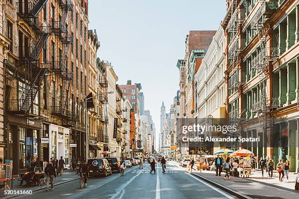 streets of soho, new york city, usa - new york person strasse stock-fotos und bilder