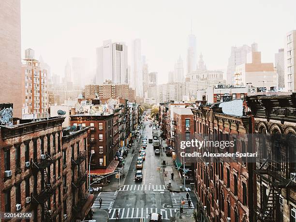 manhattan downtown skyline seen from above, new york city, usa - cloudy day office building stockfoto's en -beelden