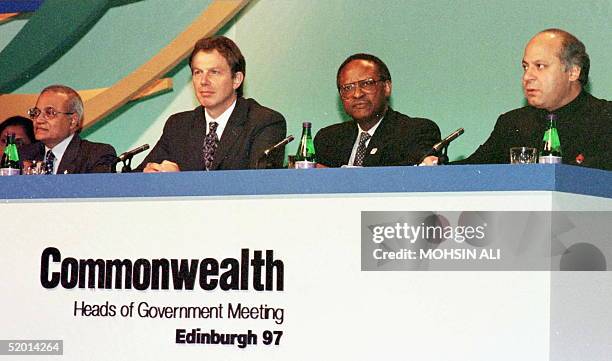 British Prime Minister Tony Blair smiles 25 October as his Pakistani counterpart Mohammad Nawaz Sharif announces before the Commonwealth summit in...