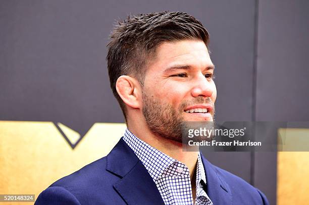 Fighter Josh Thompson attends the 2016 MTV Movie Awards at Warner Bros. Studios on April 9, 2016 in Burbank, California. MTV Movie Awards airs April...