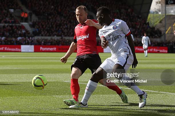 Lars Jacobsen of Guingamp and Jean Kevin Augustin of Paris Saint-Germain during the French League 1 match between EA Guingamp and Paris Saint-Germain...