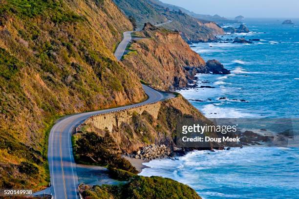 pacific coast highway at sunset - calif stock-fotos und bilder