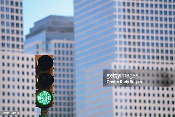 green traffic light and world financial center - grüne ampel stock-fotos und bilder