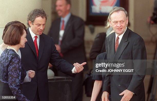 British Prime Minister Tony Blair greets his guests Canadian First Lady Aline Chretien and Canadian Prime Minister Jean Chretien at the Birmingham...