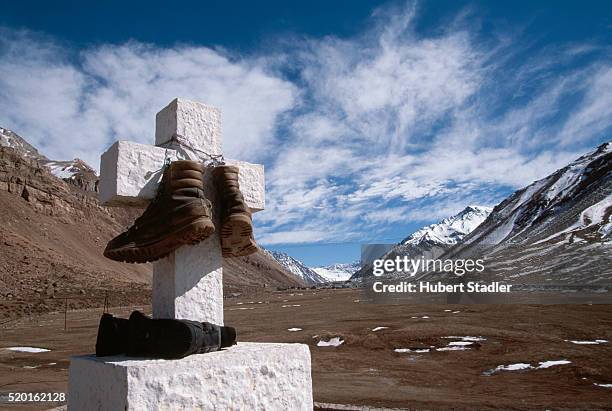 hiking boots hanging on cross near aconcagua - mount aconcagua stock pictures, royalty-free photos & images