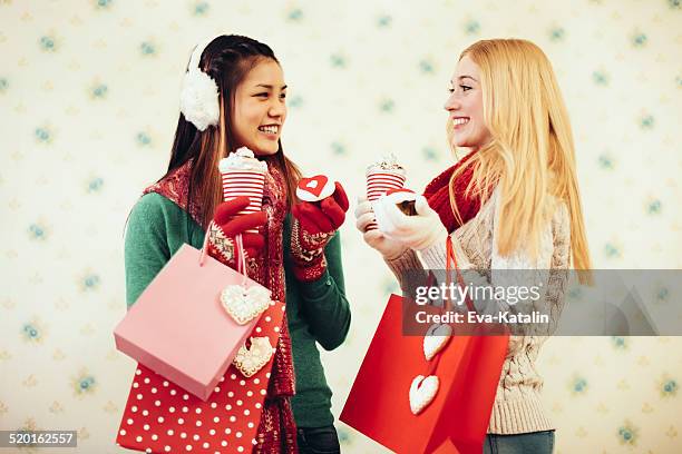 young women with shopping bags - valentines day friends stock pictures, royalty-free photos & images