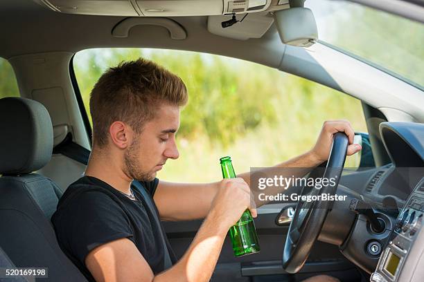 drinking beer while driving a car - rattfylleri bildbanksfoton och bilder