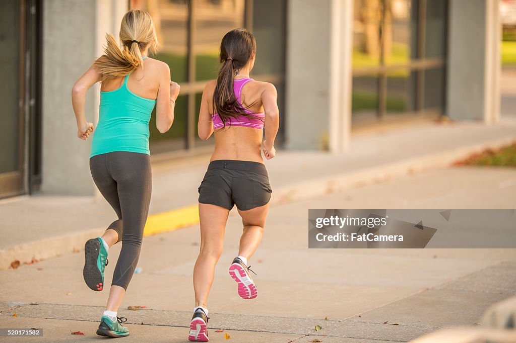 Girlfriends Running Together