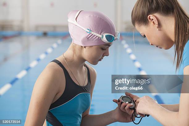 swimming lessons in the pool - swimming coach stock pictures, royalty-free photos & images