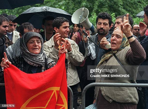 Kurdish demonstrators protest close to the US embassy in London 29 June 1999 after a Turkish court imposed the death sentence on captured Kurdish...