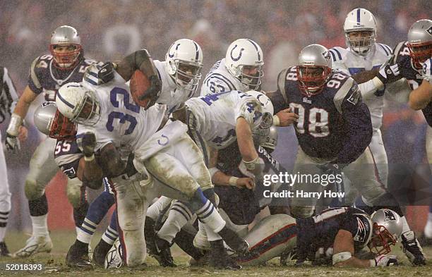 Runningback Edgerrin James of the Indianapolis Colts carries the ball against the New England Patriots during the AFC divisional playoff game at...