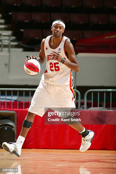 Damone Brown of the Huntsville Flight dribbles the ball against the Florida Flame during an NBDL game on December 11, 2004 at the Von Braun Center in...