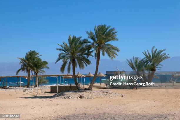 beached fishing boat - nuweiba beach stock pictures, royalty-free photos & images