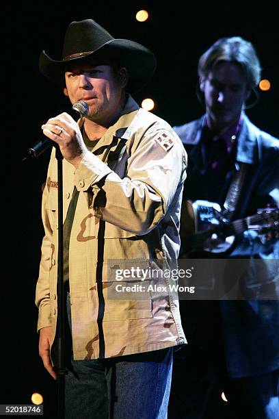 Singer John Michael Montgomery performs during the "Saluting Those Who Serve" event January 18, 2005 at the MCI Center in Washington, DC. The event...