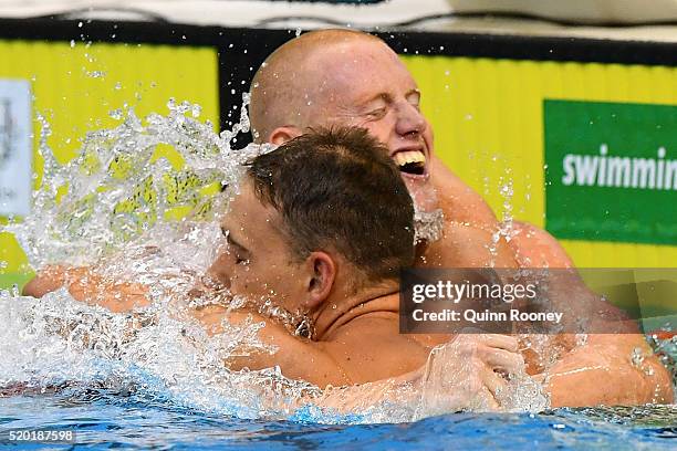 David Morgan of Australia is congratulated by Grant Irvine after winning the Men's 200 Metre Butterfly during day four of the Australian Swimming...