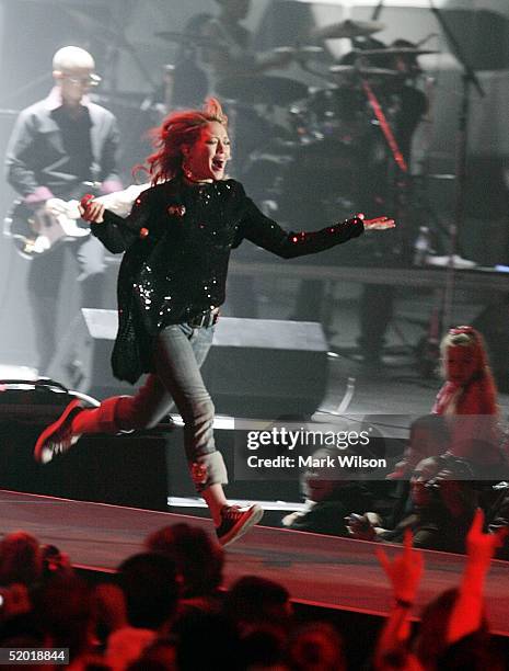 Singer Hilary Duff performs during the ?Youth Concert? hosted by Barbara and Jenna Bush, at the DC Armory, January 18, 2005 in Washington DC. The...