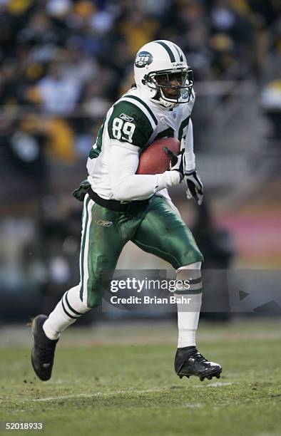 Wide receiver Jerricho Cotchery of the New York Jets returns a punt against the Pittsburgh Steelers in an AFC divisional game at Heinz Field on...