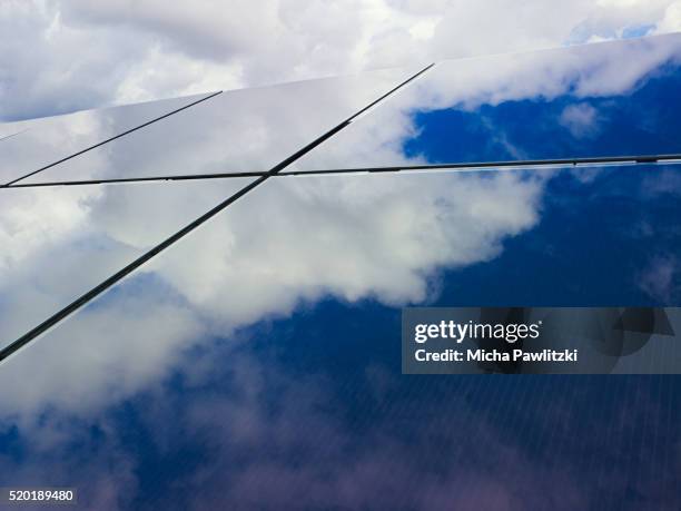 clouds reflecting on solar panels - energy transition stock pictures, royalty-free photos & images