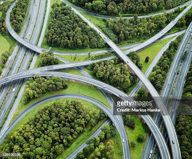 aerial view of highway intersection, germany - autostrada foto e immagini stock