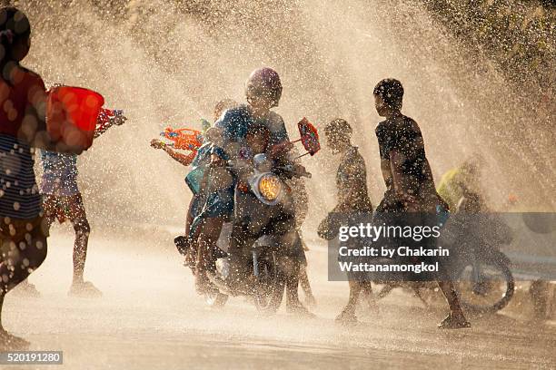 water battle (songkran festival in chanthaburi) - songkran stock pictures, royalty-free photos & images