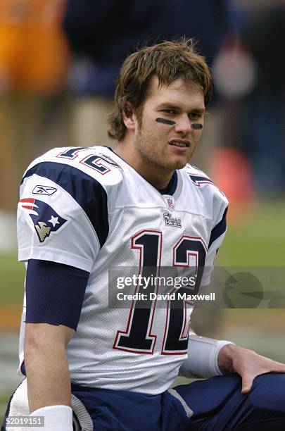 Quarterback Tom Brady of the New England Patriots watches the game against the Cleveland Browns at Cleveland Browns Stadium on December 5, 2004 in...